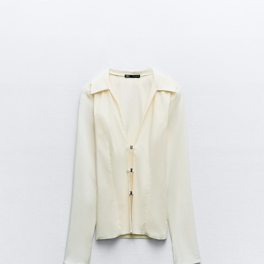 Elegant Cream Blouse with Unique Closure